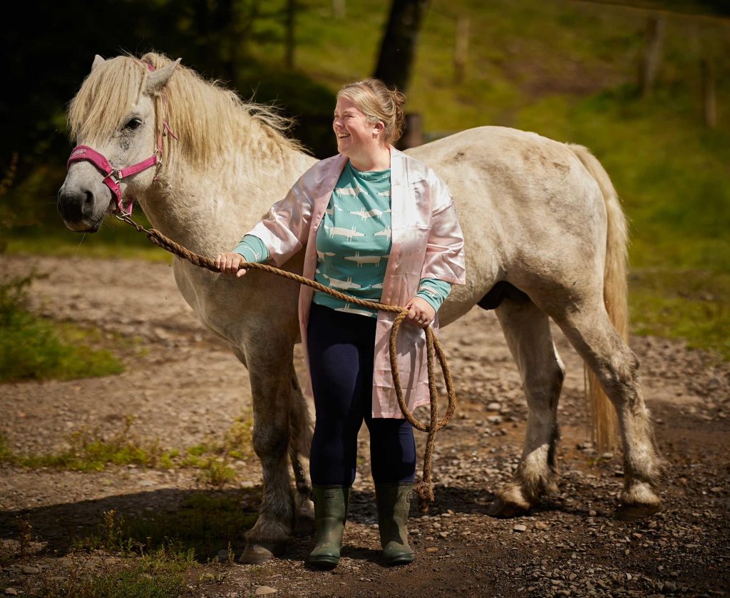 Bride with her horse before the wedding
